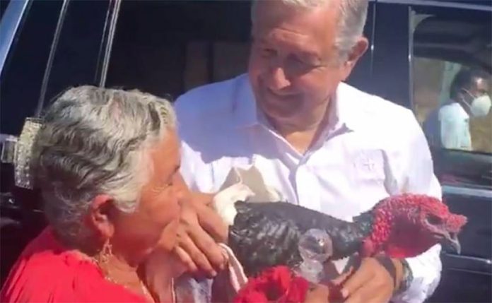 Angélica Lara of Santa Ana presents the president with a turkey