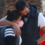 A couple share a moment of grief in Mexico City.