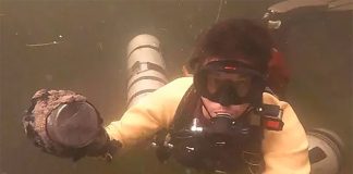 A diver with one of the meters found in a Yucatán cenote.