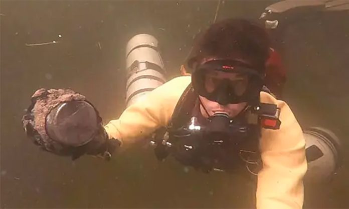 A diver with one of the meters found in a Yucatán cenote.