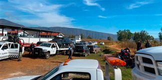 Vehicles abandoned by crime gangs in Michoacán are towed by authorities Thursday.