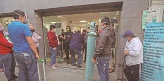 Customers line up for oxygen refills at a Mexico City supplier.