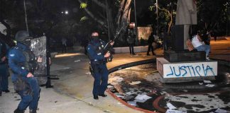 Police fired their weapons during a demonstration in Cancún.