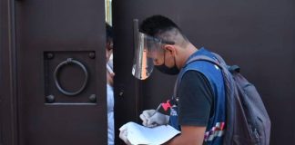 A healthcare worker goes door-to-door to conduct Covid-19 tests in Mexico City.