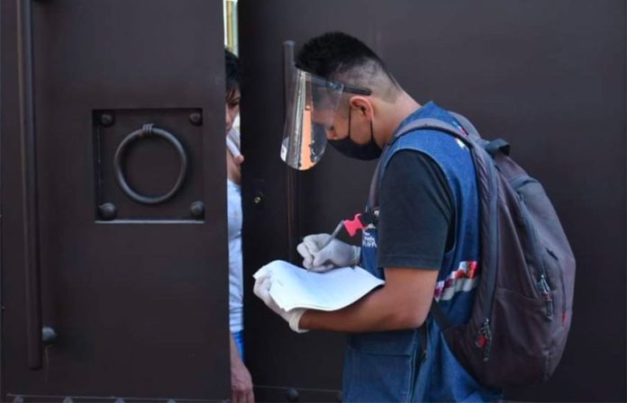 A healthcare worker goes door-to-door to conduct Covid-19 tests in Mexico City.