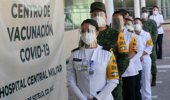 Candidates for Covid vaccination line up at a military hospital in Mexico City.