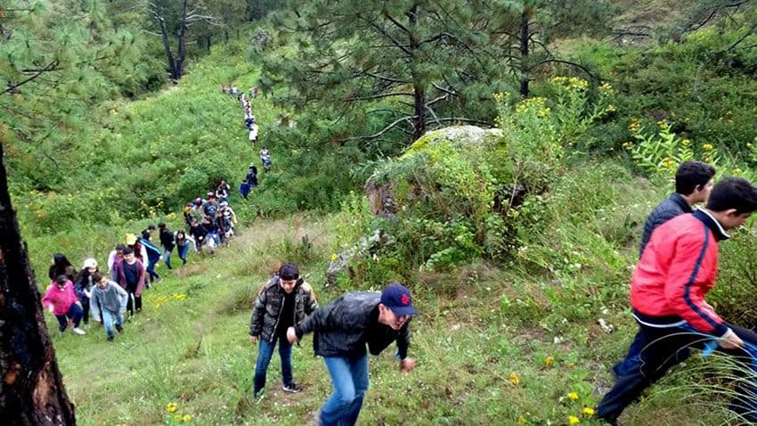 Youngsters hike a picturesque trail at Ecoturismo.