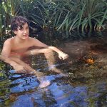 Relaxing in the transparent, 38-degrees Celsius waters around Las Cuevas.