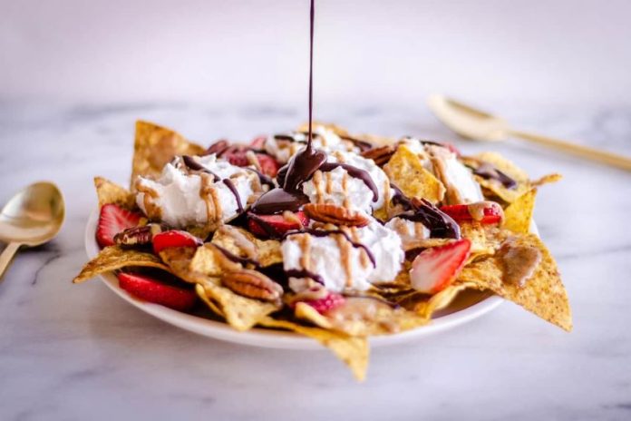 Topped with chocolate and fresh fruit, nachos make an appealing dessert.