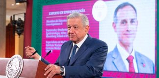 The president shows his support for the deputy minister at Wednesday's press conference.