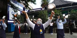 Restaurant workers make some noise in Mexico City.