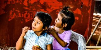 Zihuatanejo primary school children eating at a free community kitchen formed by residents of the La Presa II neighborhood after Covid closed a school lunch program.