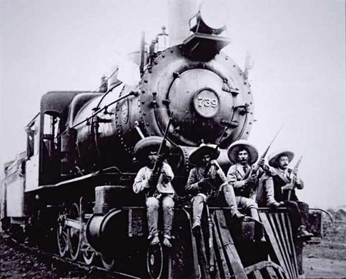 Pancho Villa and friends ride the cowcatcher.