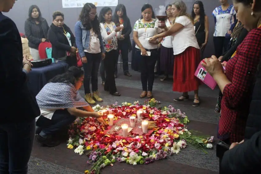 An altar opens a meeting of the Association of Intercultural Bilingual Mediators.