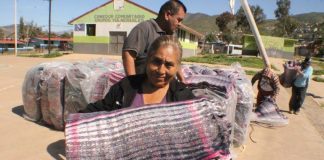 Distributing blankets for the frigid winter nights in Baja California.