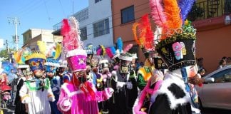 Chinelos accompany the image of the Niñopa (a baby Jesus statue) in the Mexico City borough of Xochimilco during an annual procession.