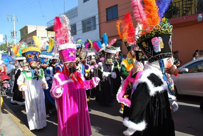 Chinelos accompany the image of the Niñopa (a baby Jesus statue) in the Mexico City borough of Xochimilco during an annual procession.