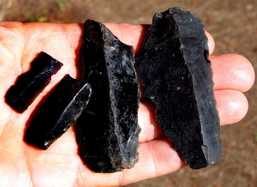 Broken pieces of obsidian blades and knives.