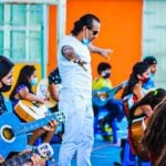 Juan Rubén Antúnez teaches guitar to students in poor neighborhoods for free.