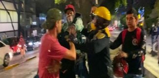 Police and cyclists during Friday's dustup.