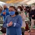 Health promotion workers get the crowd warmed up during vaccinations in Iztacalco.