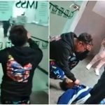 The dead man's son, left, pleads with hospital personnel to open the door