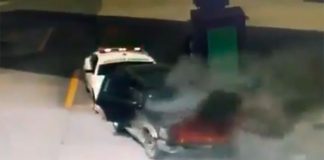 The burning truck is pushed away from the pumps at a gas station in Tlaxcala.