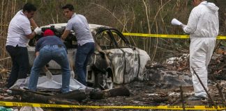 Investigators at the crime scene in Camargo.