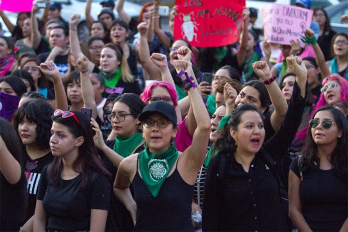 Women march against gender violence at a Mexico City protest in 2019.