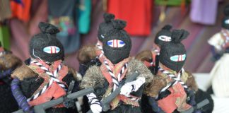 Zapatista dolls with trademark balaclava, rifle and bandolier.
