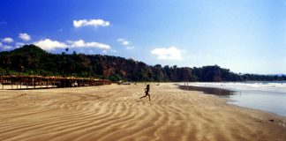 Long, beautiful Los Cocos beach has soft sand and small waves.