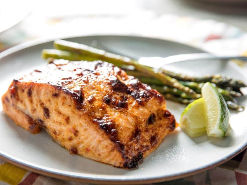 While optional, a bit of harissa or other chili paste gives broiled salmon a nice kick.