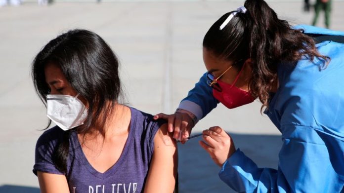 A woman receives a Covid-19 vaccine in Querétaro in December.