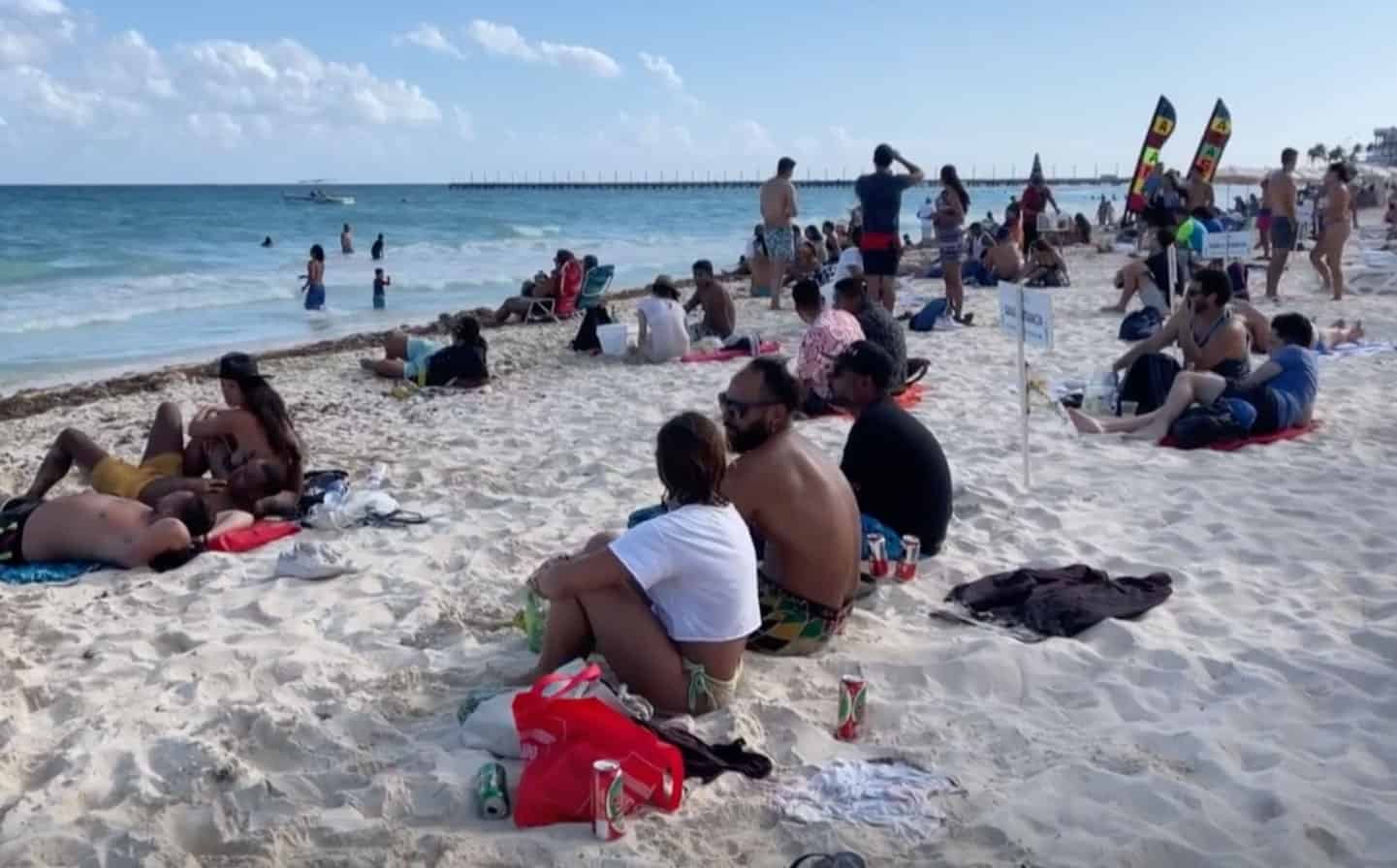 Visitors enjoy the beach in Tulum.