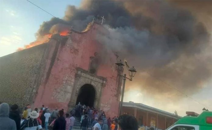 The historic church in flames on Sunday.