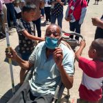 Javier, left, with his great-grandfather and younger brother.