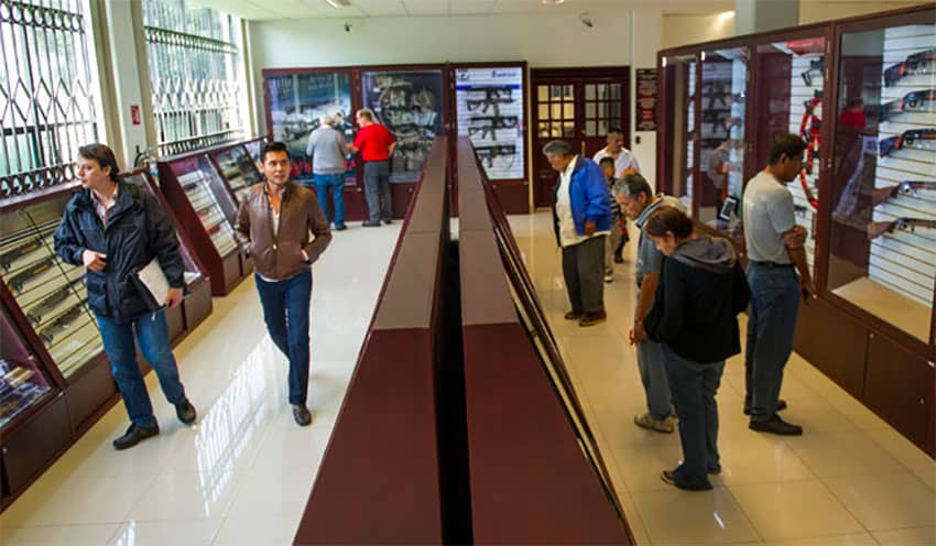 Shoppers browse the selection of weapons at Mexico's only gun shop.