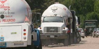 Tanker trucks at the scene of an LP gas pipeline tap.
