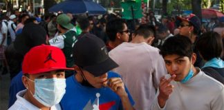 Youths toke up at the pot market adjacent to the Senate building in Mexico City.