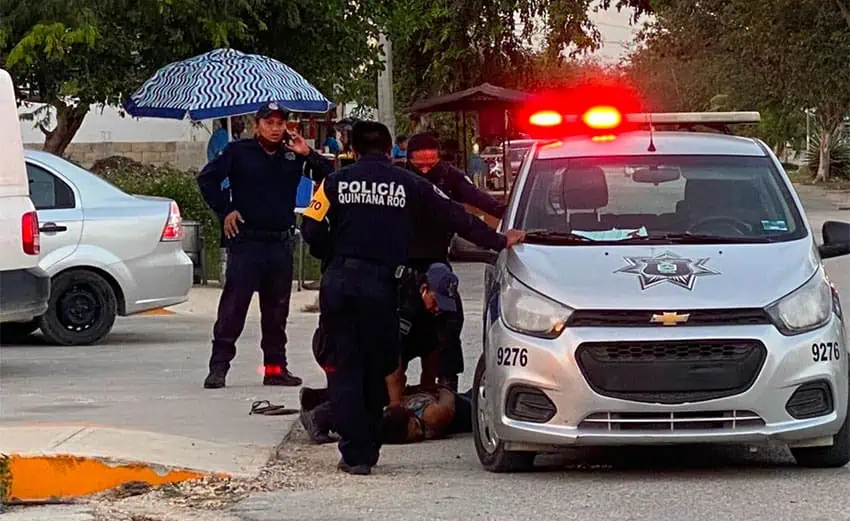 police pin down woman in Tulum