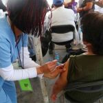 A healthcare worker administers a vaccine shot in Hidalgo.