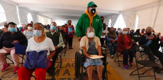 Candidates for vaccination await their turn.