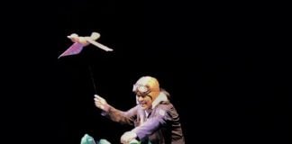 Ángel Ledezma onstage, acting as a narrator.