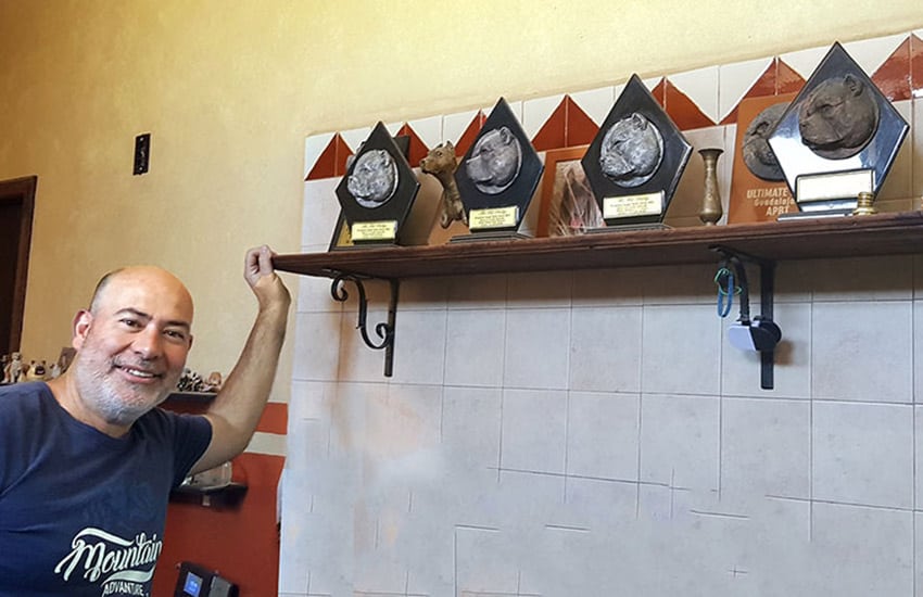 Ortiz with his dog show trophies.