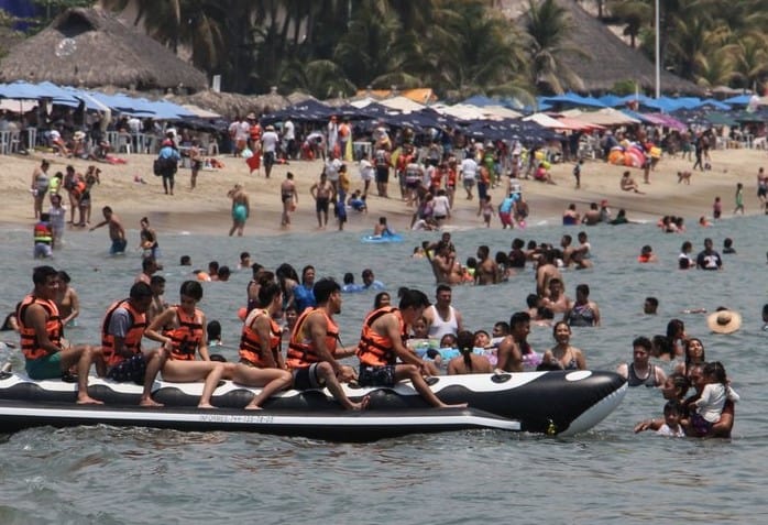 Social distancing was not the watchword at many of Mexico's beaches this weekend.