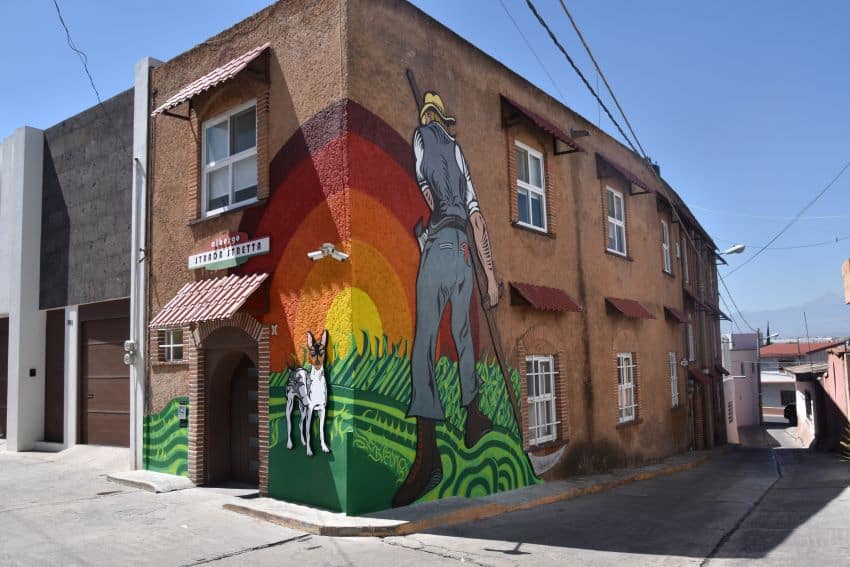 This mural of a larger-than-life farmer is meant to evoke Chipilo's history when it was more a rural area than now, says artist Iván Galeazzi.