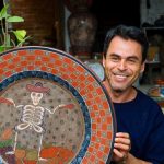 José Luis Cortéz with an example of his pottery.