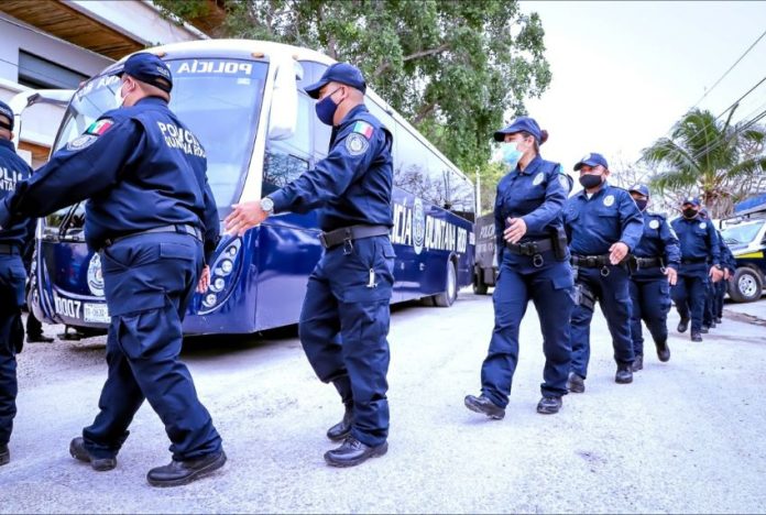 A group of 30 Tulum police officers arrive at the Quintana Roo state police academy in Chetumal for an enforced 216 hours of training in policing techniques and tactics.