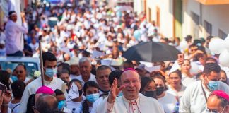 Archbishop Coppola leads a procession Friday through Aguililla, Michoacán.