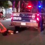 Police arrest a man in Tulum on Wednesday.